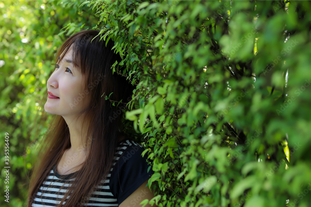 Portrait beautiful asian adult woman with happiness and smile face. Attractive beauty female looking nice natural view. She is 47 years old but pretty woman looks young, use for insurance advertising Portrait beautiful asian adult woman with happiness and smile face. Attractive beauty female looking nice natural view. She is 47 years old but pretty woman looks young, use for insurance advertising