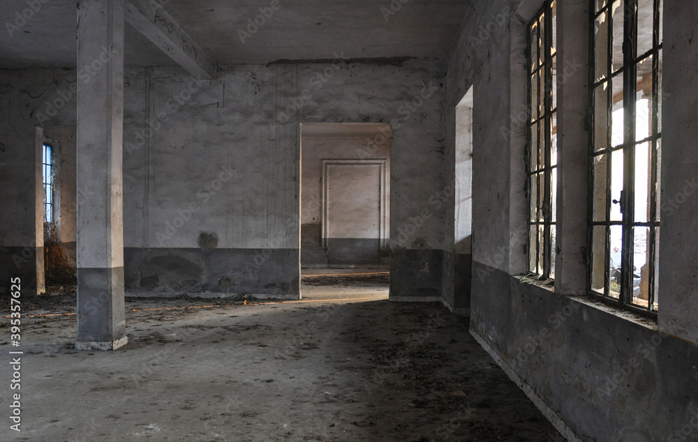 Abandoned factory with light coming through the windows