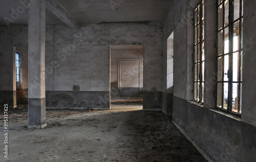 Abandoned factory with light coming through the windows © Francesca