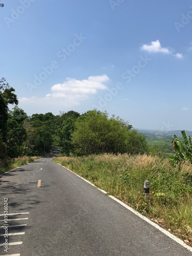 Rural road through the hills in Phuket, Thailand 