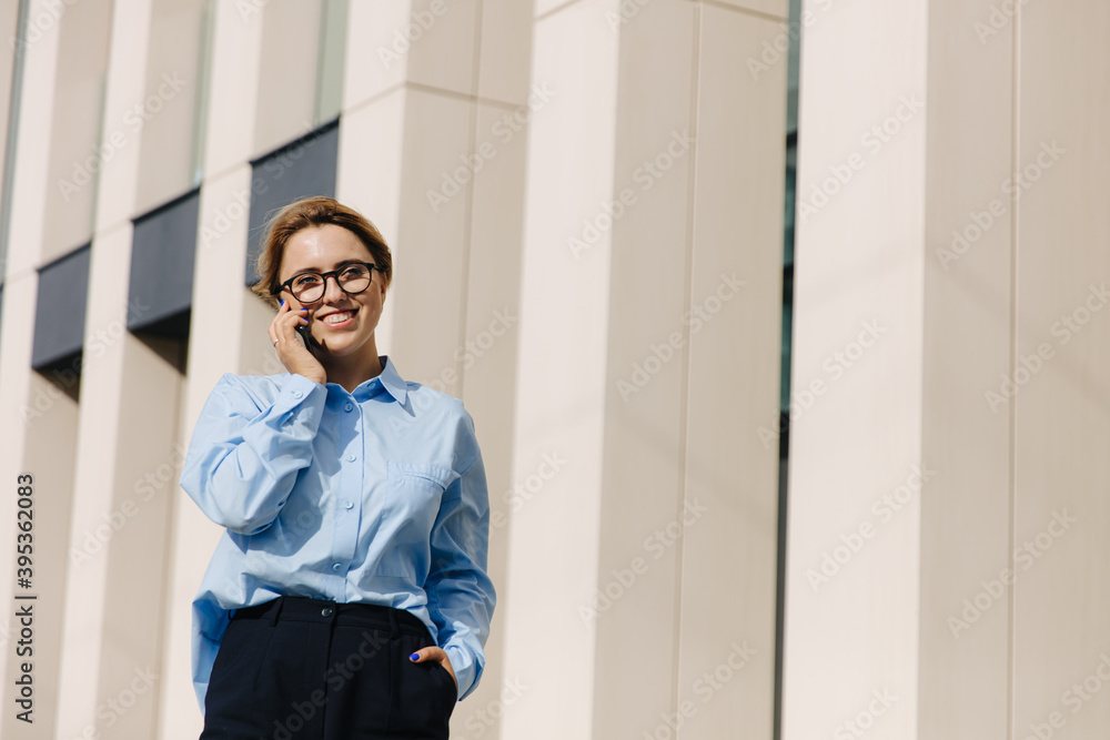 Attractive female using mobile for chatting on fresh air Attractive female using mobile for chatting on fresh air