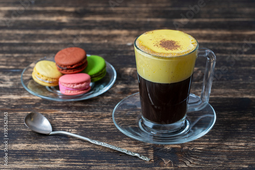 Traditional vietnamese egg coffee made of raw egg yolk and condensed milk, close up photo