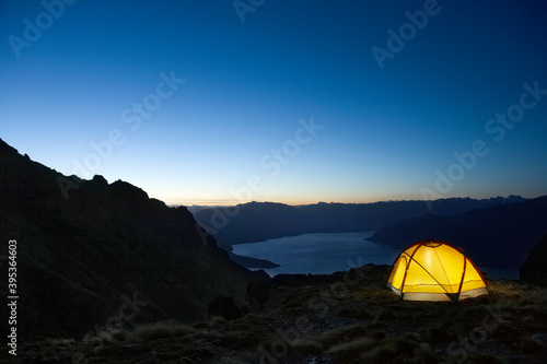 Tent By Lakeshore At Dusk