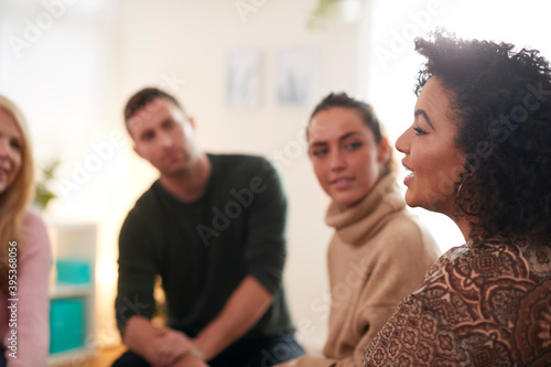 Woman Speaking At Support Group Meeting For Mental Health Or Dependency Issues In Community Space photo