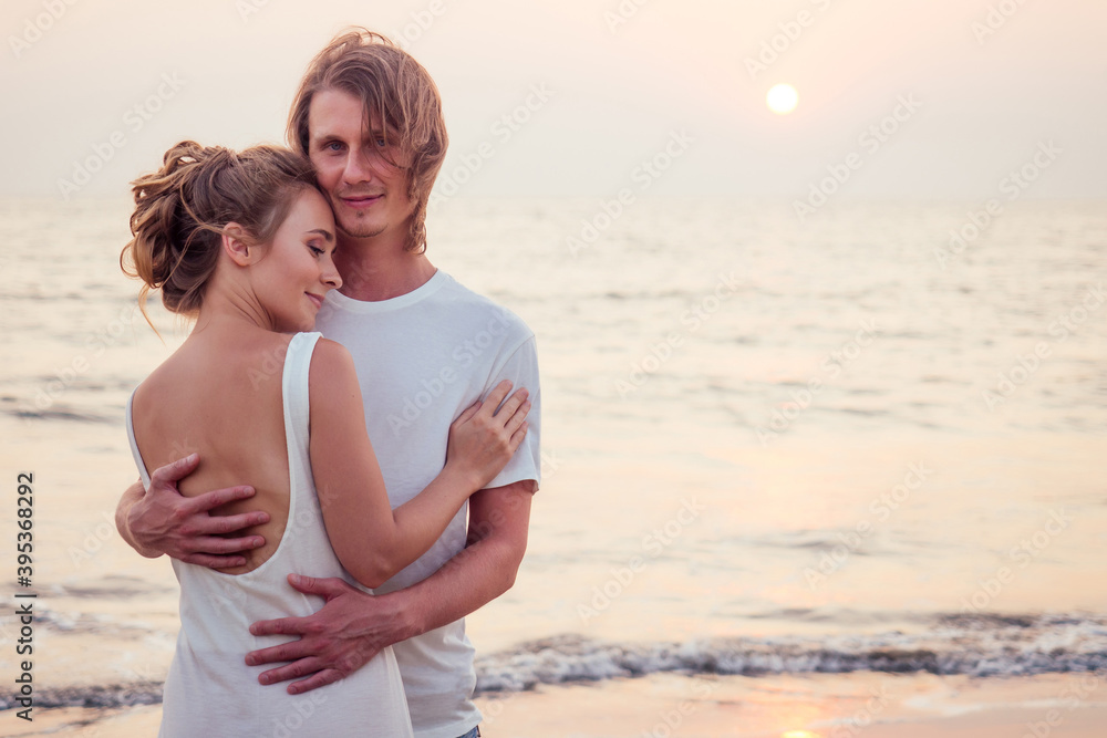Justmarried couple running on a sandy beach Justmarried couple running on a sandy beach