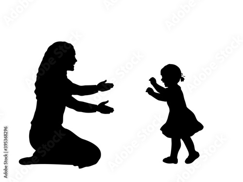 Silhouette of little daughte taking the first steps towards his mother