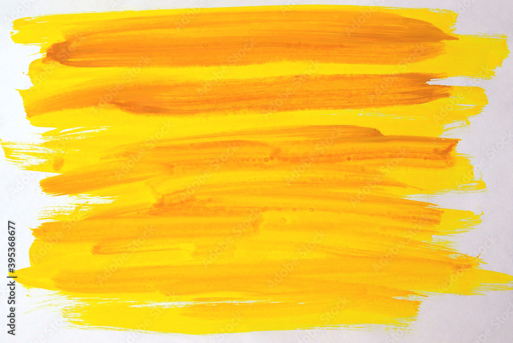 Yellow hand painted brush stroke daub on a white background. gouache.