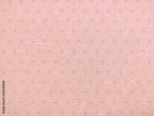 ピンク色の麻の葉模様の和紙テクスチャ背景素材