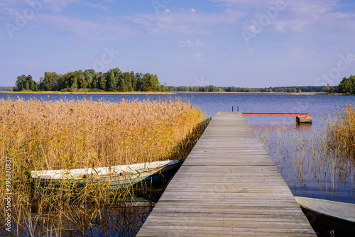 Fototapeta Naklejka Na Ścianę i Meble -  Beautiful landscape with a lake and a boat dock. Vuoksa lake - a picturesque lake in Leningradskaya oblast, Russia