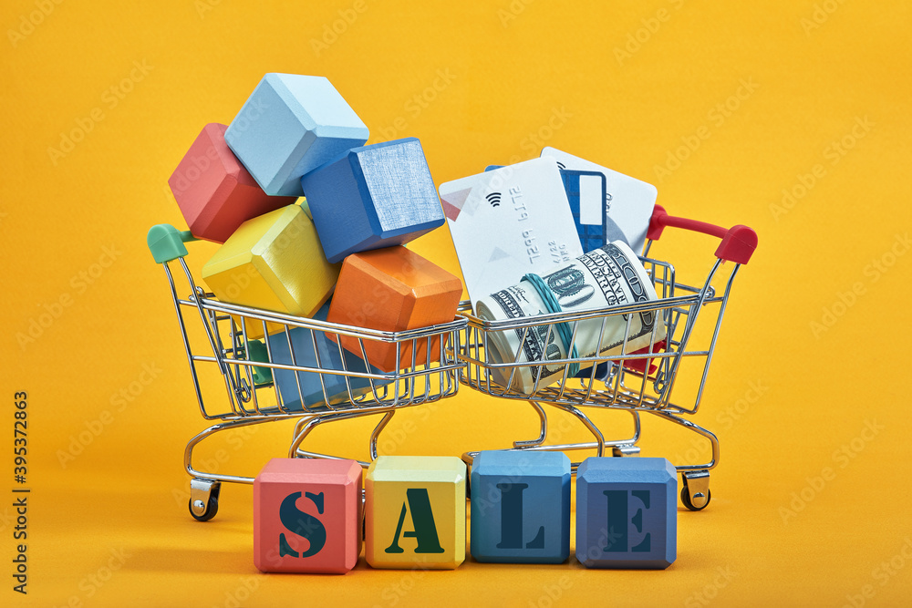 different colored blocks with the wordings SALE, isolated against yellow background.