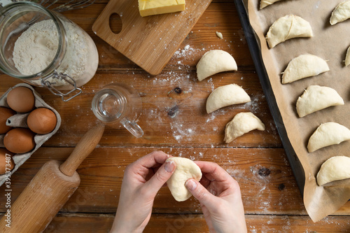 Women preparing homemade food pie, pizza in a cozzy kitchen. Hobbies and family life concept. photo