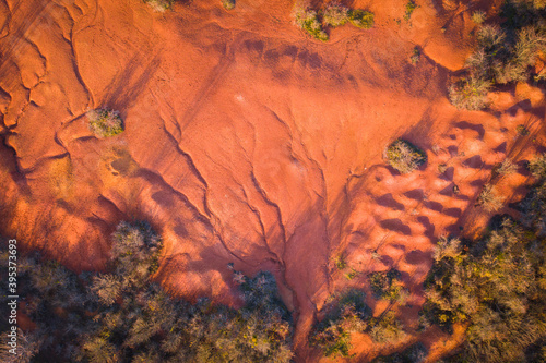 Gant, Hungary - Aerial view of abandoned bauxite mine, bauxite formation, the red mountains resembling Martian landscape. Red and orange colored surface, bauxite texture, warm autumn colors. photo