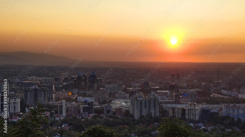 View from a height to the city of Almaty. Evening and sunset. Kazakhstan