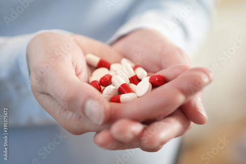 Hands Holding Medicine Pills