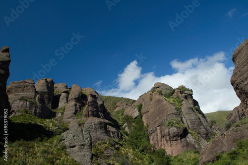 Unique landscape. View of the mountains and rock formations peaks under a deep blue sky in Los Terrones natural reserve in Córdoba, Argentina.