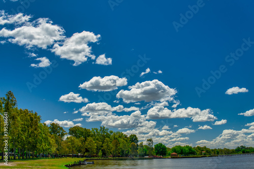  Landscape of Lobos lake on a warm spring morning, under a blue sky with a few white clouds       
