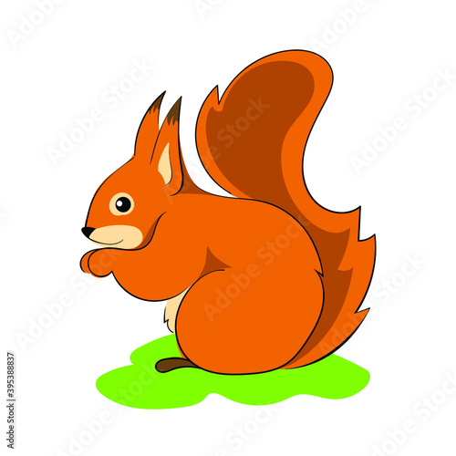 Red squirrel sitting on the grass.