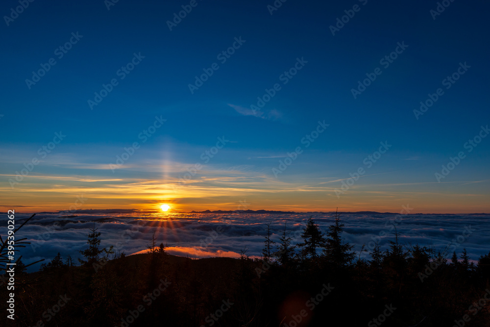 Inversion in the valley during sunrise with mountain ridge in the background, Beskydy , Czech Republic. Inversion in the valley during sunrise with mountain ridge in the background, Beskydy , Czech Republic.