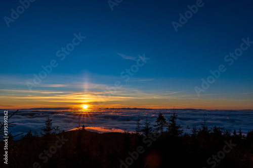 Inversion in the valley during sunrise with mountain ridge in the background, Beskydy , Czech Republic.