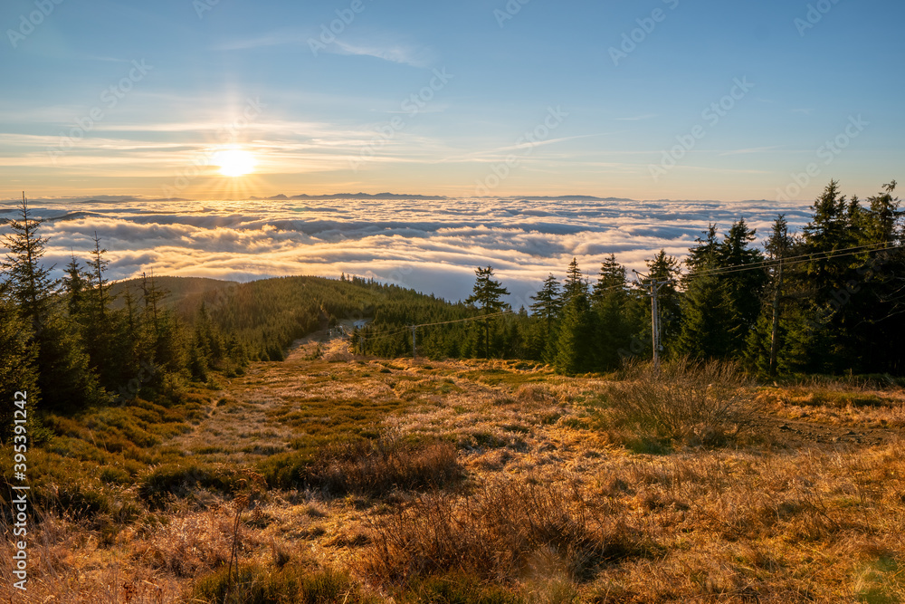 Inversion in the valley during sunrise with mountain ridge in the background, Beskydy , Czech Republic.