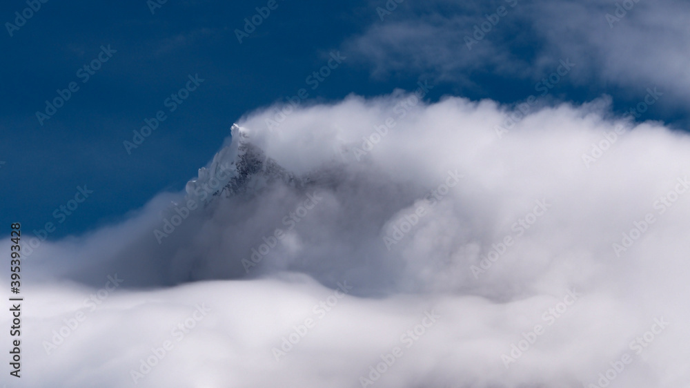 peak of Cerro Paine Grande covered in clouds, patagonia