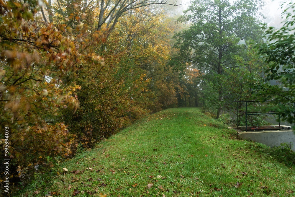 Foggy morning on the embankment of the pond in autumn. East Moravia. Czech Republic. Europe. Foggy morning on the embankment of the pond in autumn. East Moravia. Czech Republic. Europe.