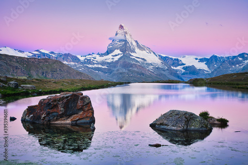 Reflection of Matterhorn mountain in Stellisee lake at sunrise photo