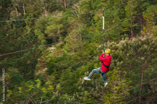 Woman descending by cables in a sport called zip-line over green forest in a valley near Canela. A charming small town very popular by its ecotourism in southern Brazil. Oil Paint filter.