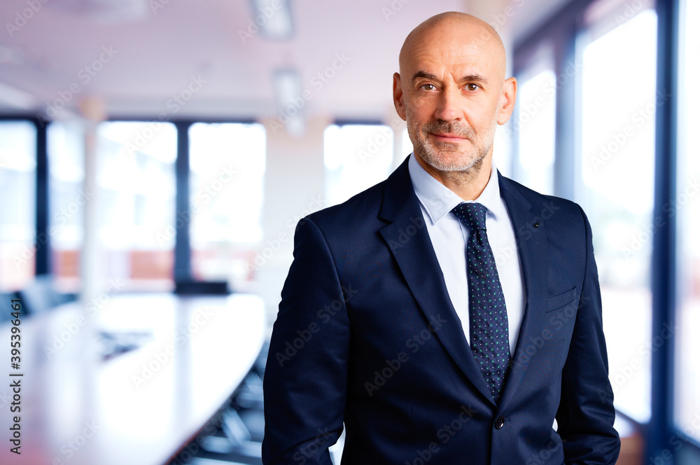 Executive senior businessman standing in the office Executive senior businessman standing in the office