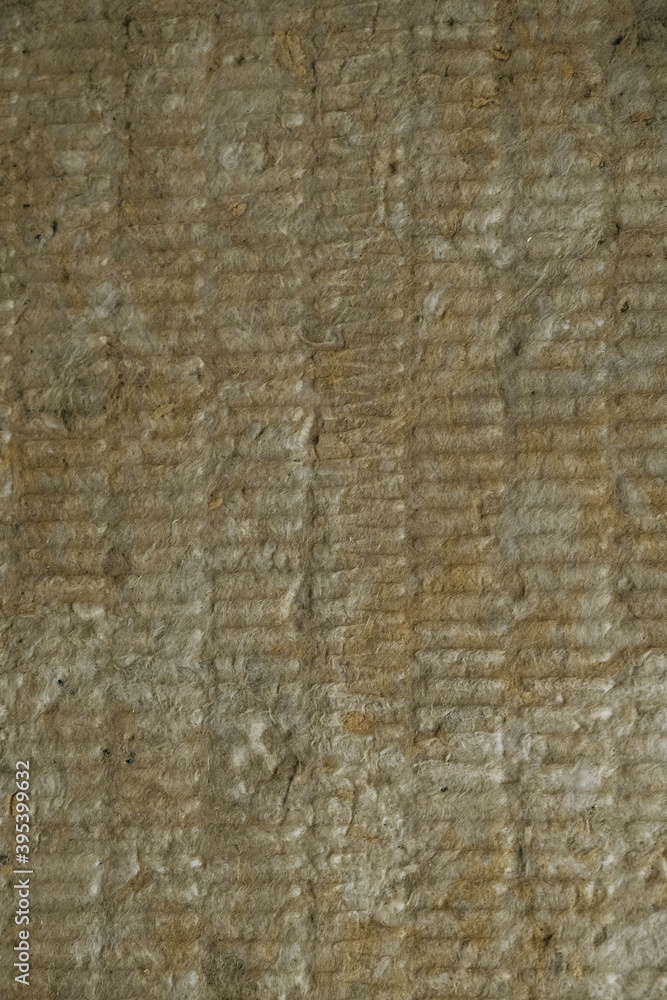 Mineral wool for insulating the walls as a background image texture. Top view. Copy, empty space for text Mineral wool for insulating the walls as a background image texture. Top view. Copy, empty space for text