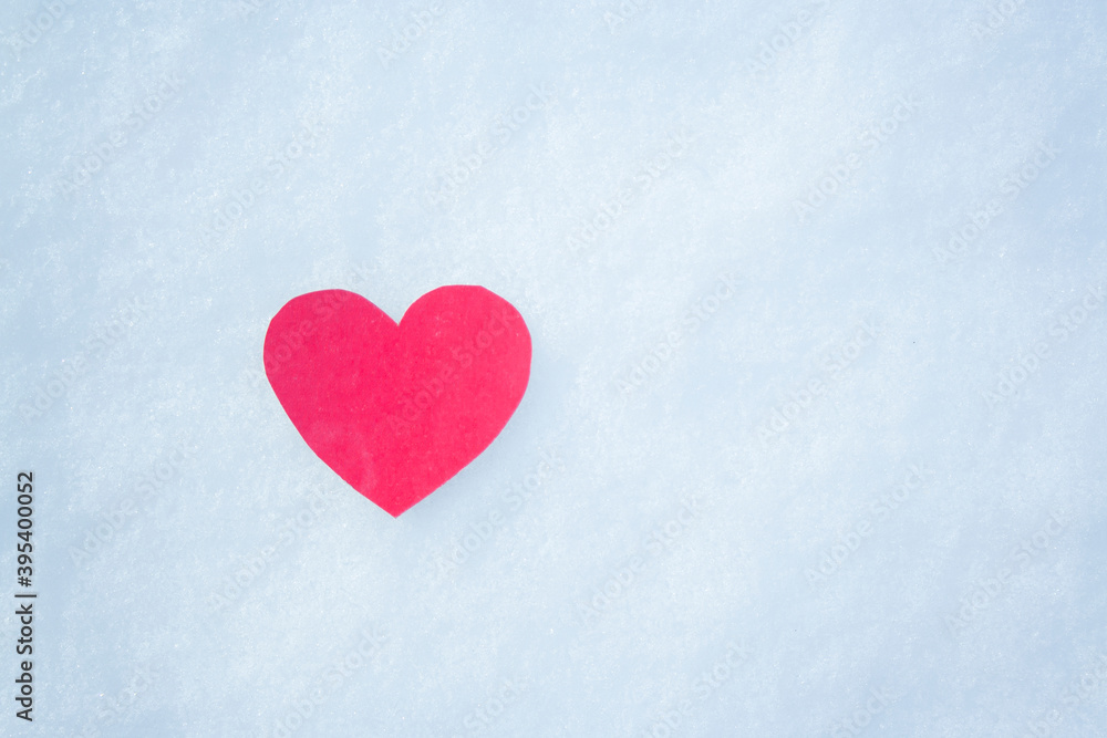 paper red heart on snow with snowflakes. Love winter. Valentine day, mother day, woman day. Copy space.