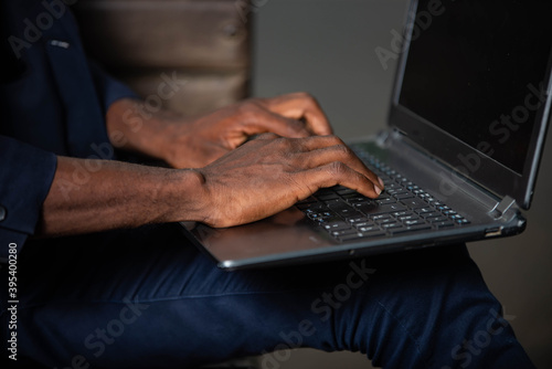 beautiful male hand typed laptop