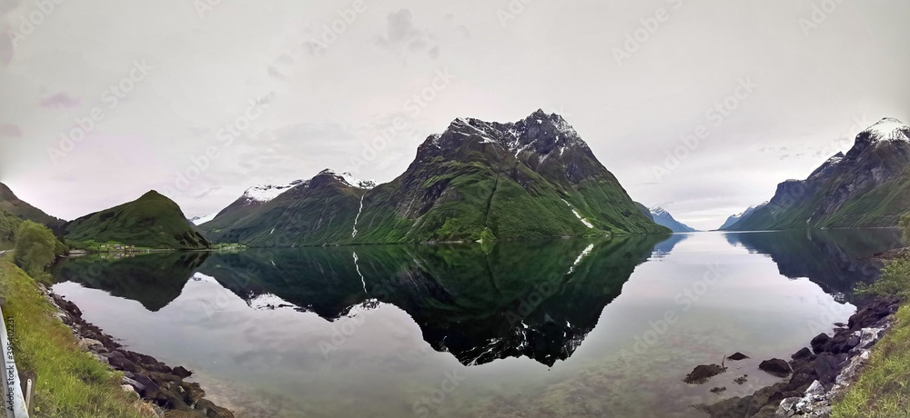beautiful panorama from the shore into the Hjorundfjord near Bjorke, Norway