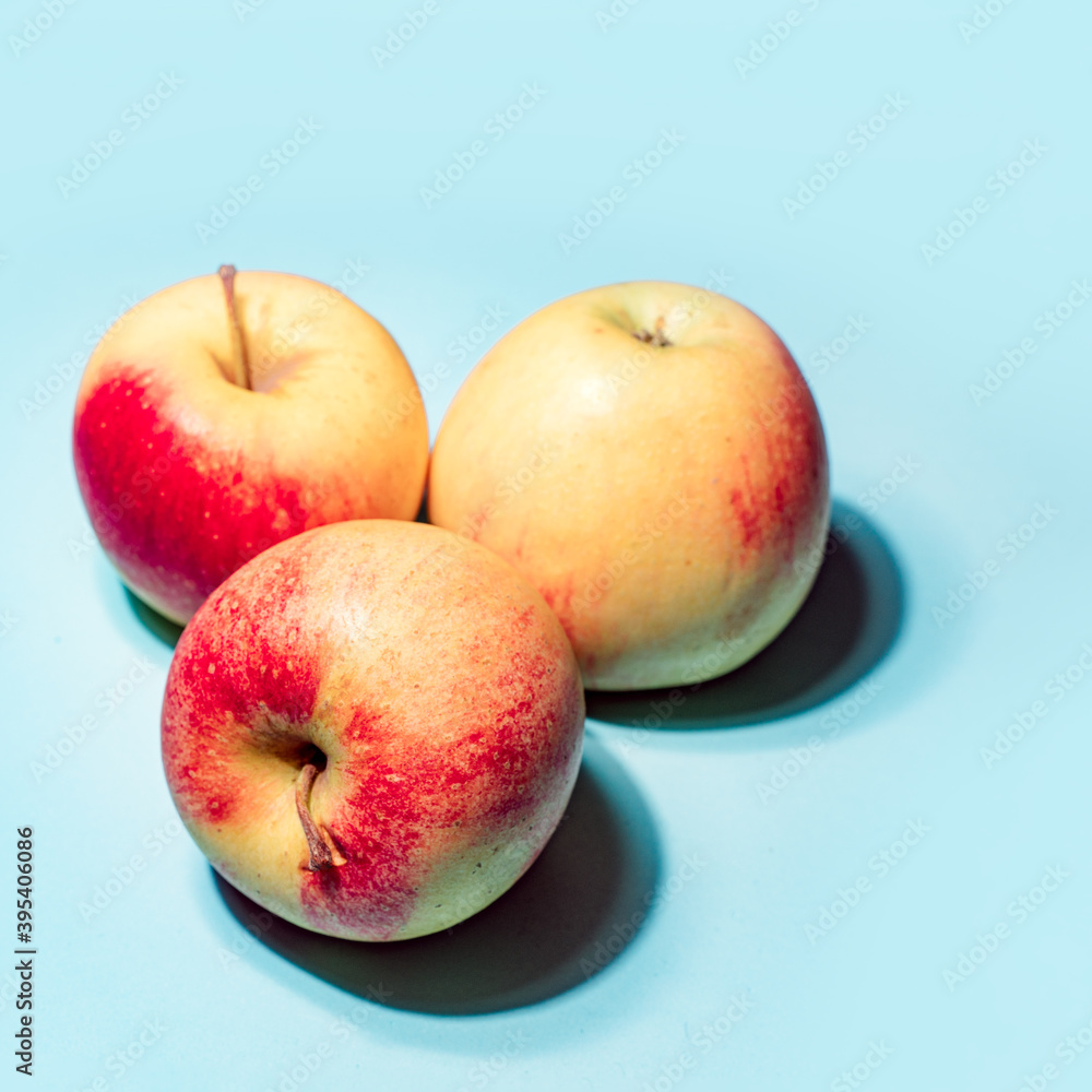 Apples on blue background art image Apples on blue background art image