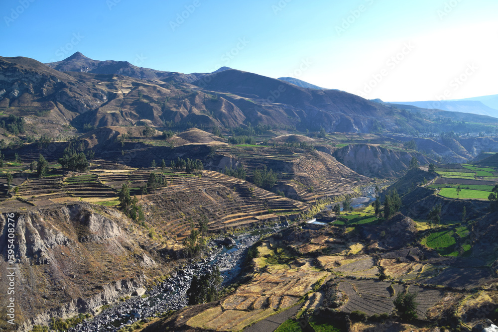 Obraz premium Beautiful view of the Colca Canyon landscape in Peru on an early morning with very little water in the river that runs through the valley