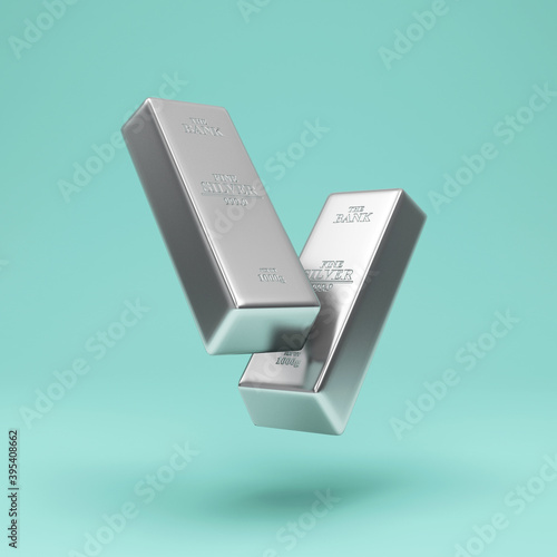 Floating Two Silver Bars on turquoise studio background