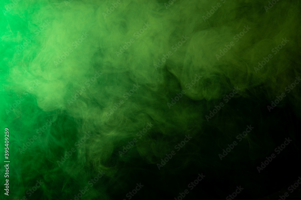 Green smoke on black background