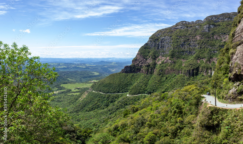 Landscape of the winding road of Corvo Branco and its beautiful nature on a blue sky day. Brazil
