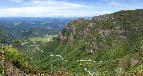 Landscape of the winding road of Corvo Branco and its beautiful nature on a blue sky day. Brazil