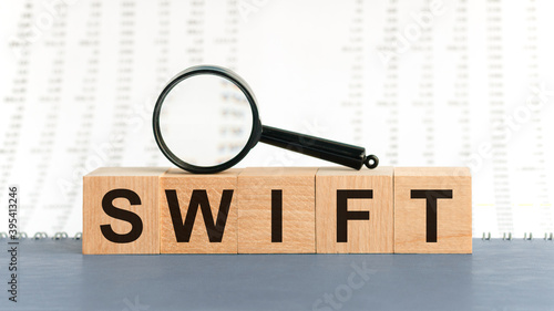 Wooden Blocks with the text: SWIFT with magnifying glass.