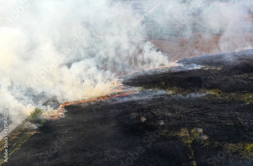 Top view of grass burning in the field
