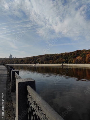 Luzhnetskaya embankment in Moscow. View of autumn trees and Stalin's skyscraper