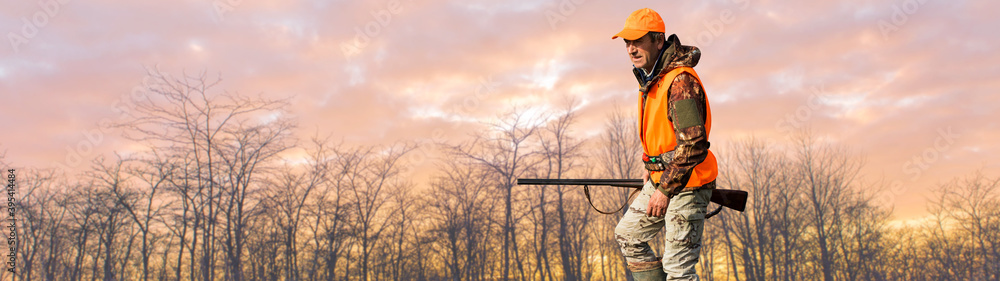 Silhouette of a hunter with a gun against the sun, an ambush for ducks. Silhouette of a hunter with a gun against the sun, an ambush for ducks.