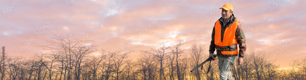 Silhouette of a hunter with a gun against the sun, an ambush for ducks. Silhouette of a hunter with a gun against the sun, an ambush for ducks.
