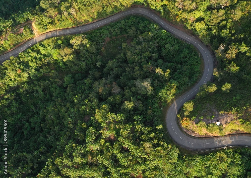 Aerial view of hilly region showing forests, roads and slopes. Aerial view of hilly region showing forests, roads and slopes.