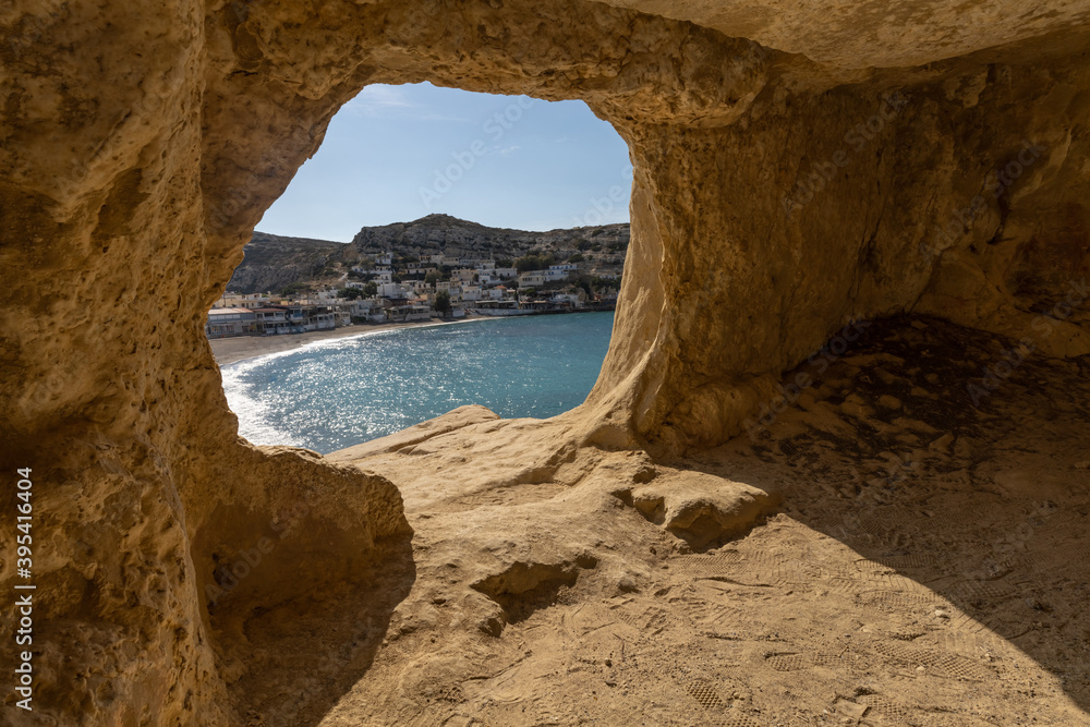 Stunning Roman catacombs carved on the sandstone cliffs above the Matala Beach, Crete, Greece. In Roman times, the dead were buried in them, later they were used by the first Christians
