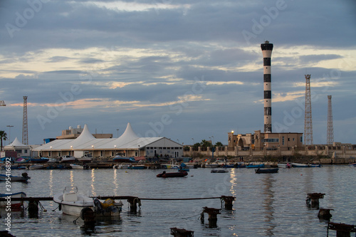 Tripoli, Libya - November 25, 2020: The port of Tripoli during sunset on a normal working day.