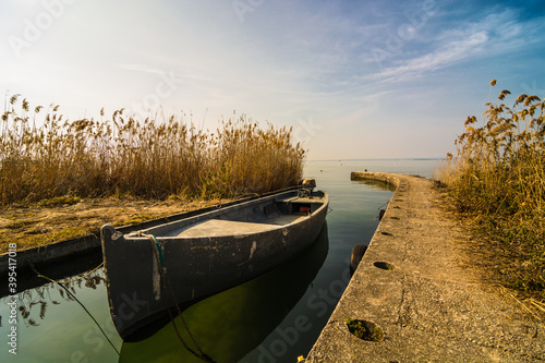 small motor boat moored in a canal