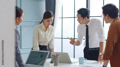 Group of young Asian business people meeting and brainstorming in office