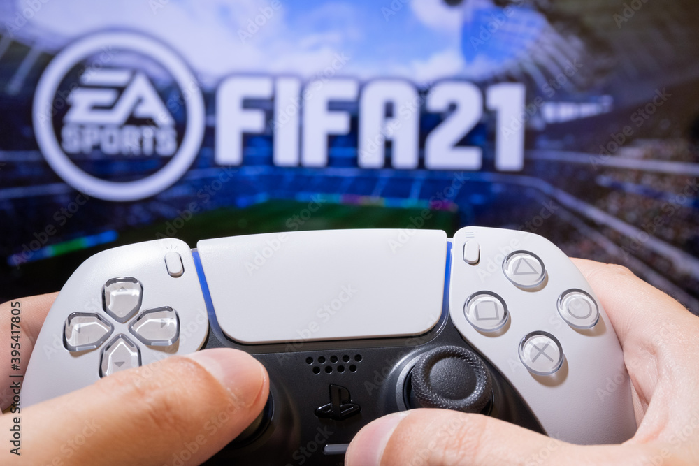 Man play FIFA 21 with Playstation 5 Dual Sense - 25th November, 2020, Sao  Paulo, Brazil. Stock Photo | Adobe Stock